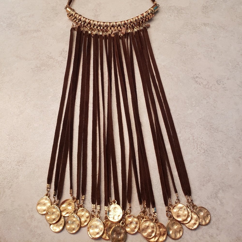 Beautiful and unique brown and gold necklace with beads and gold "coin" details.